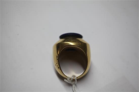A heavy high carat gold and lapis lazuli set ring, size M.